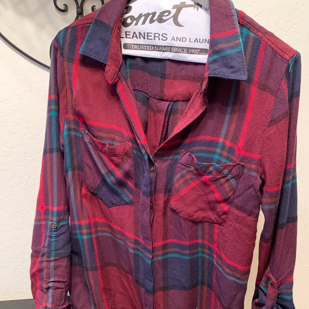 Plaid shirt with button back detail.